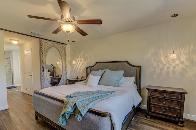 bedroom with ceiling fan and dark wood-type flooring