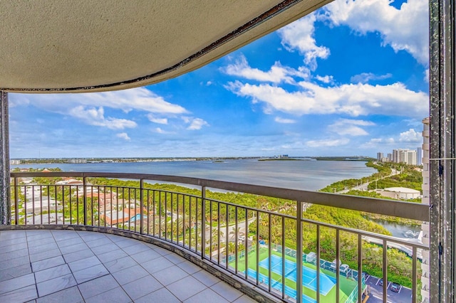 balcony featuring a water view