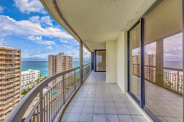 balcony featuring a water view