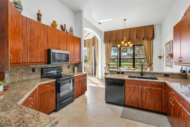 kitchen with sink, decorative light fixtures, decorative backsplash, black appliances, and a notable chandelier