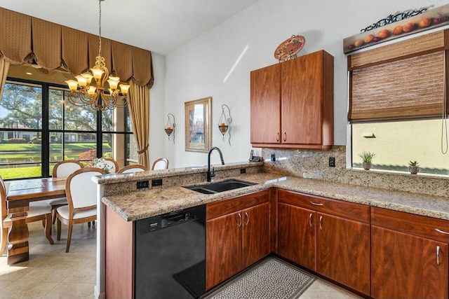 kitchen featuring sink, dishwasher, light stone counters, kitchen peninsula, and a chandelier