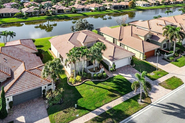 birds eye view of property with a water view