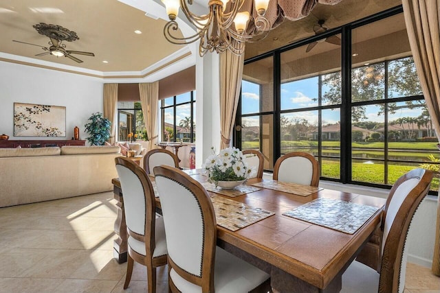 tiled dining area featuring ceiling fan with notable chandelier and ornamental molding