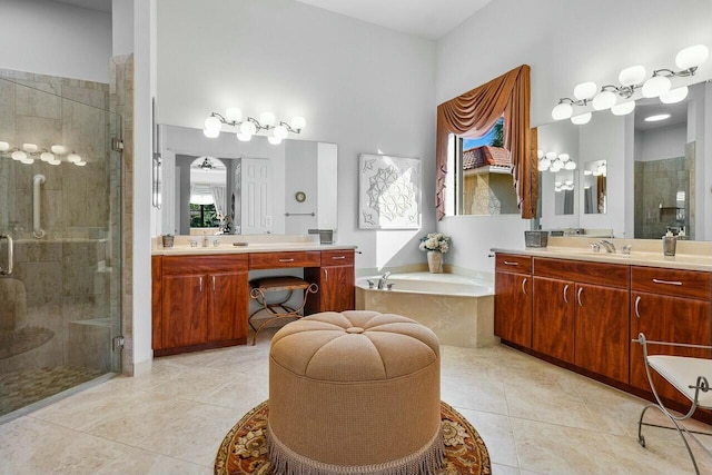 bathroom with vanity, tile patterned flooring, and separate shower and tub