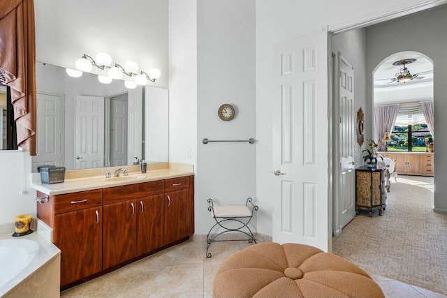 bathroom with ceiling fan, vanity, and tile patterned floors