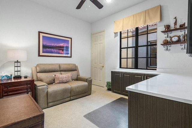 living room featuring light colored carpet and ceiling fan