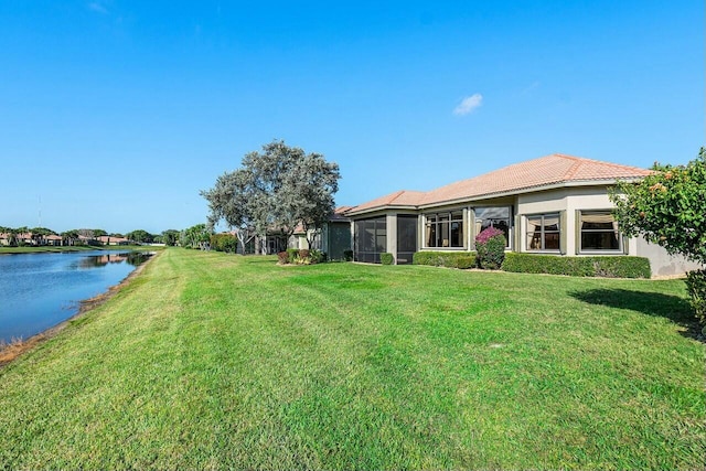 view of yard with a water view