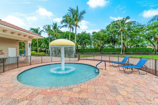 view of swimming pool featuring a patio