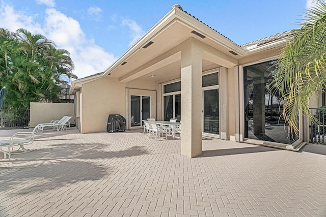 rear view of house with a patio