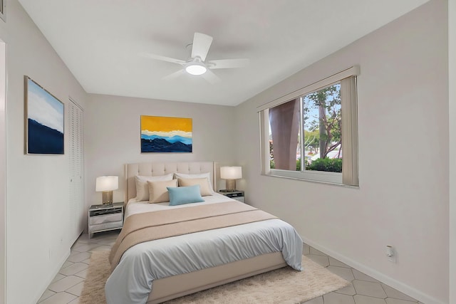 bedroom featuring ceiling fan and light tile patterned floors