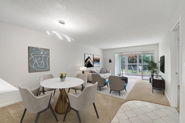 carpeted dining space with a textured ceiling and a chandelier