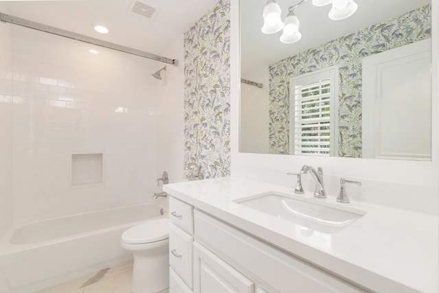 full bathroom featuring toilet, tiled shower / bath, vanity, and an inviting chandelier