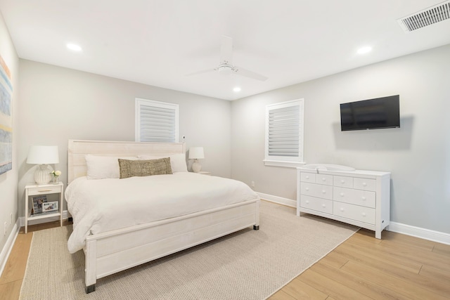 bedroom featuring light wood-type flooring and ceiling fan