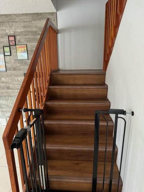 stairway with wood walls