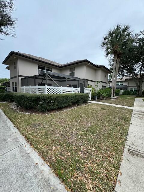 view of side of home featuring a yard