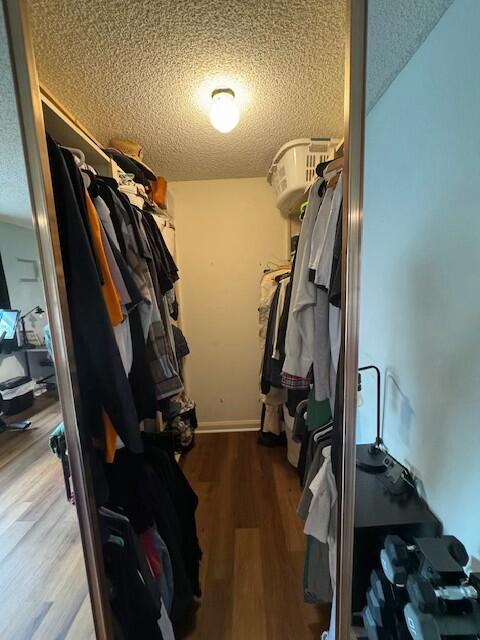 spacious closet featuring hardwood / wood-style floors