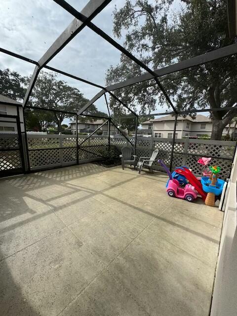 view of patio with a lanai