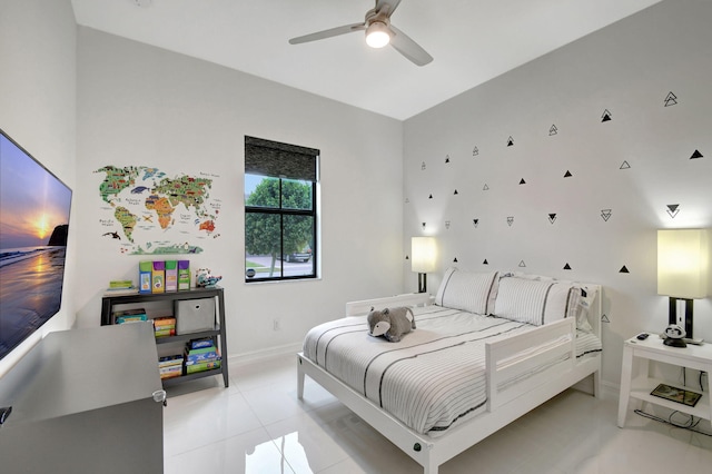 bedroom with ceiling fan and light tile patterned floors