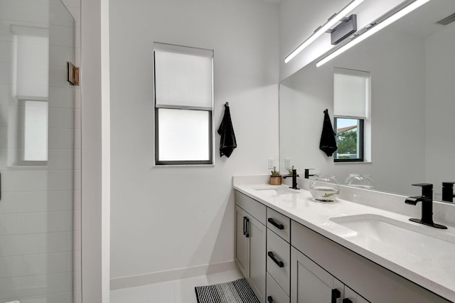 bathroom with tile patterned flooring and vanity