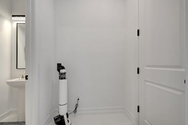 bathroom with tile patterned floors and sink