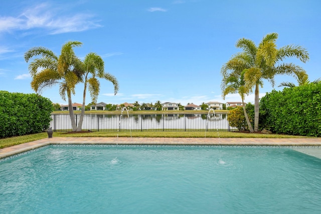 view of pool featuring a water view