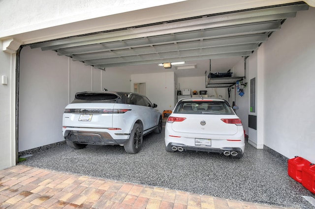 garage with electric panel and a garage door opener