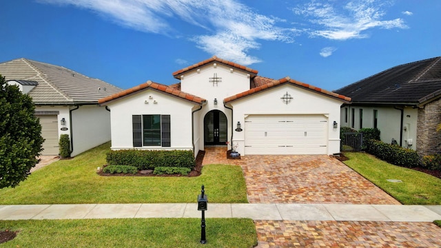 view of front of property featuring a front lawn and a garage