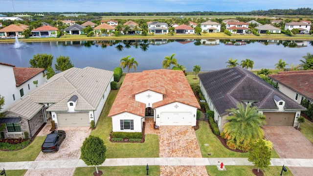 birds eye view of property featuring a water view