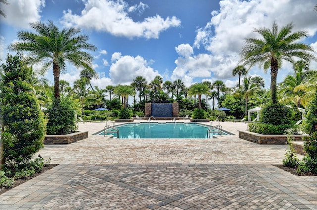 view of swimming pool featuring a patio area