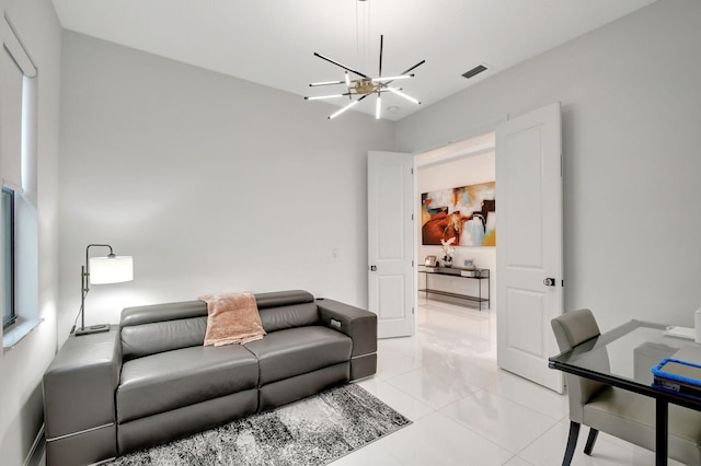 tiled living room with a notable chandelier