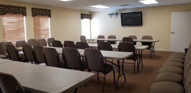 home theater featuring a drop ceiling and carpet flooring