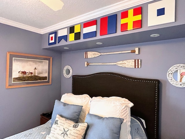 bedroom featuring a textured ceiling and crown molding