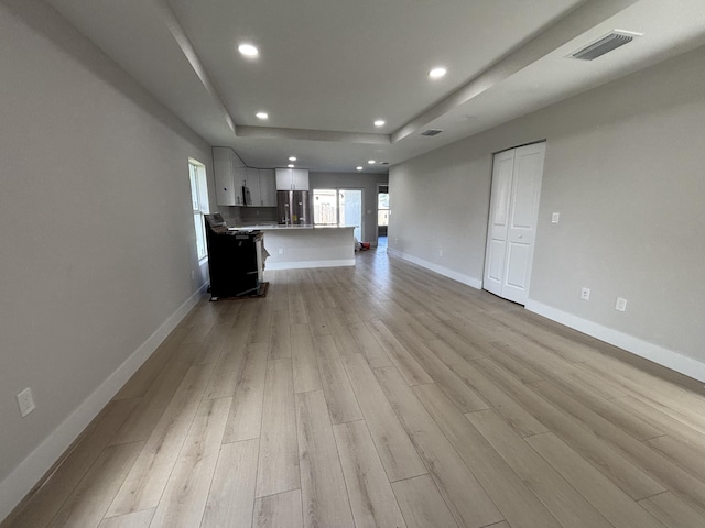 unfurnished living room with light hardwood / wood-style floors