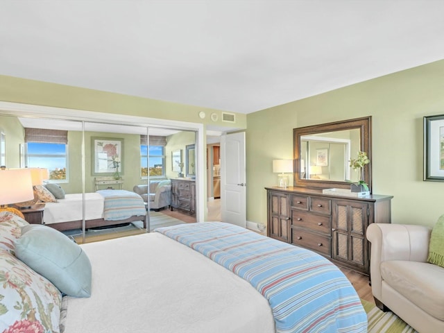 bedroom featuring a closet and light hardwood / wood-style floors