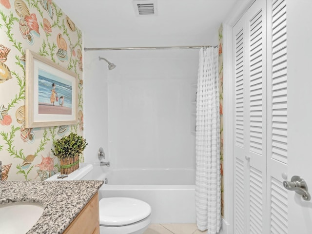 full bathroom featuring tile patterned flooring, shower / tub combo with curtain, vanity, and toilet