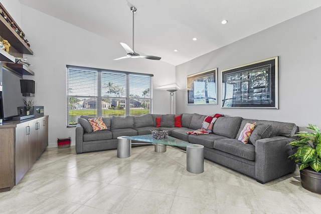 living room with ceiling fan and vaulted ceiling