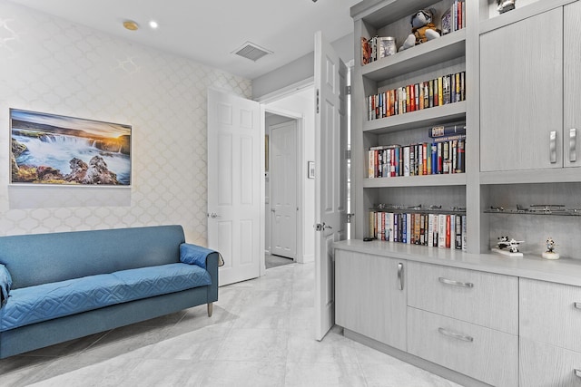 sitting room with built in shelves