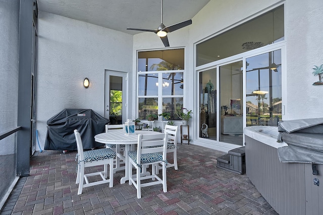 view of patio with ceiling fan and a grill