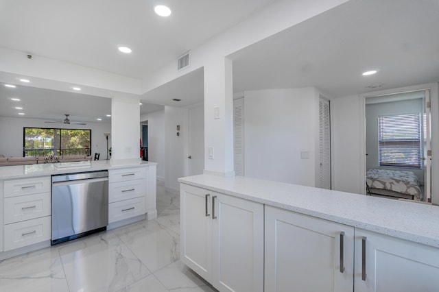 kitchen featuring white cabinets, light stone countertops, dishwasher, and ceiling fan