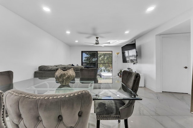 dining space featuring ceiling fan