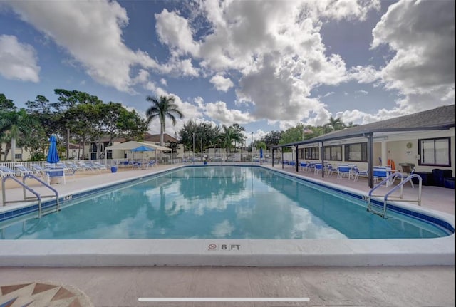 view of swimming pool with a patio area