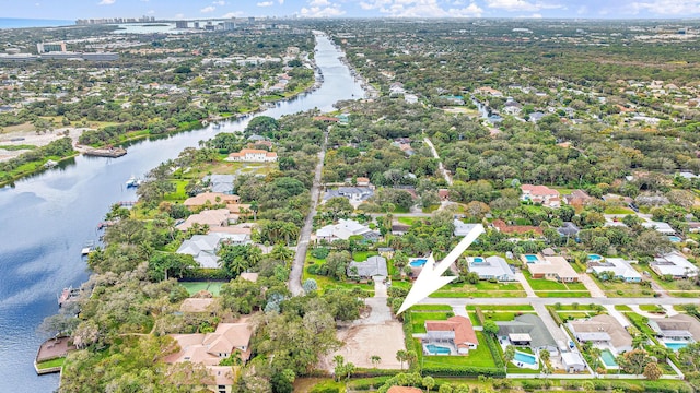 birds eye view of property featuring a water view