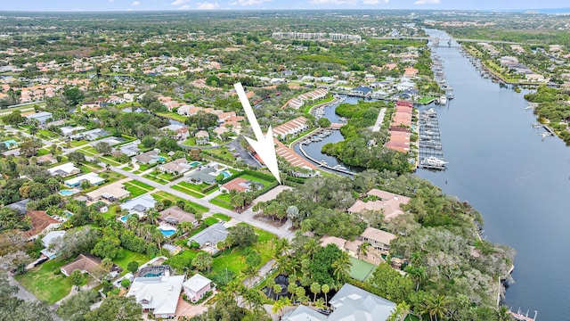 birds eye view of property featuring a water view