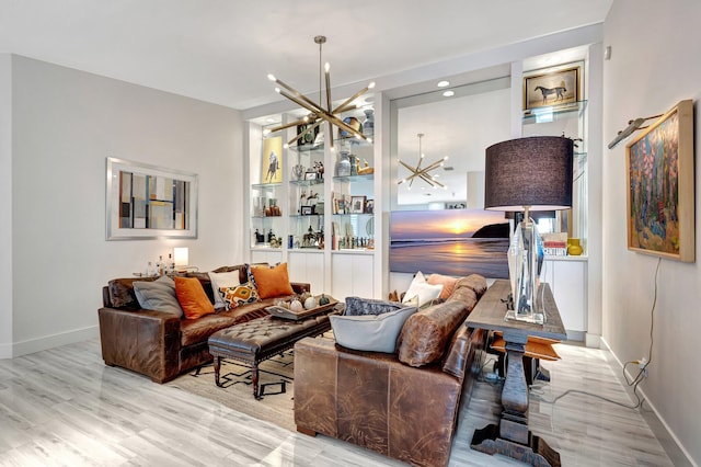 living room with light hardwood / wood-style flooring and a chandelier