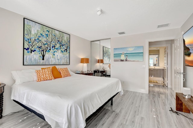 bedroom featuring hardwood / wood-style flooring and a closet