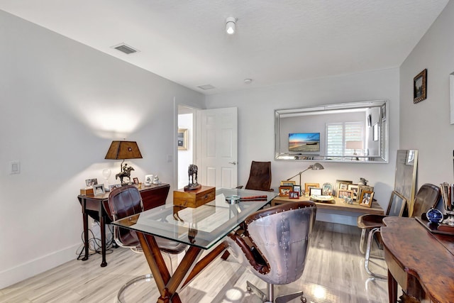 office space featuring light hardwood / wood-style floors