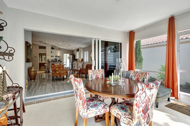 dining area with vaulted ceiling