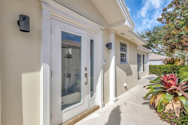 property entrance featuring a patio area