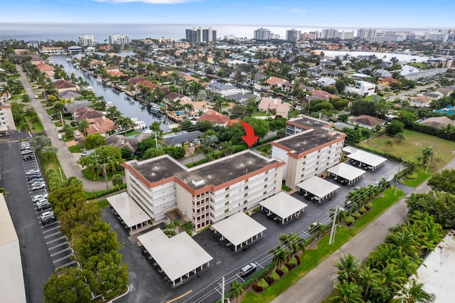 birds eye view of property featuring a water view