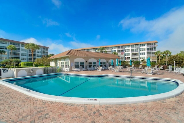 view of swimming pool with a patio area